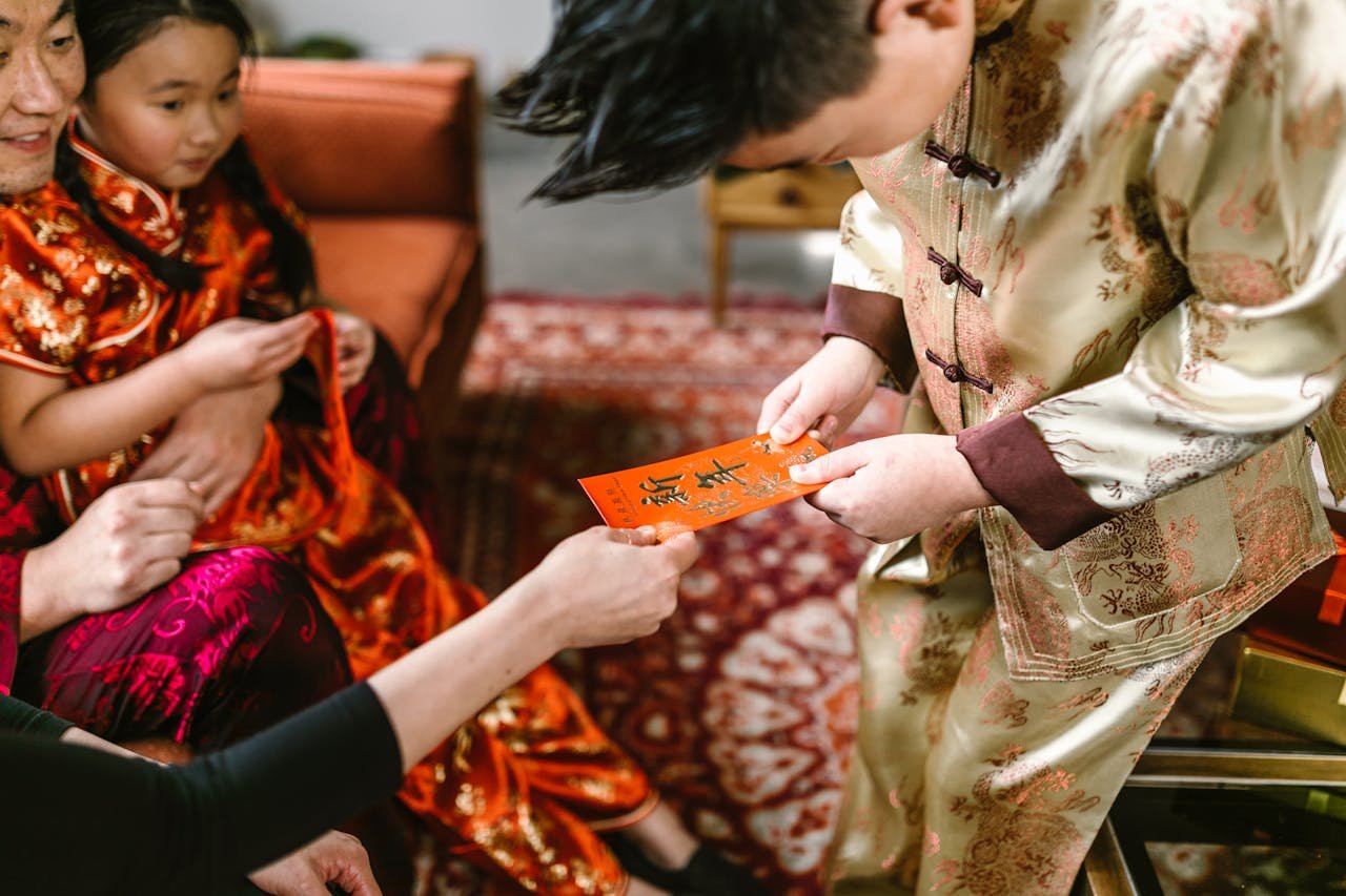 A Boy Receiving an Ang Pao